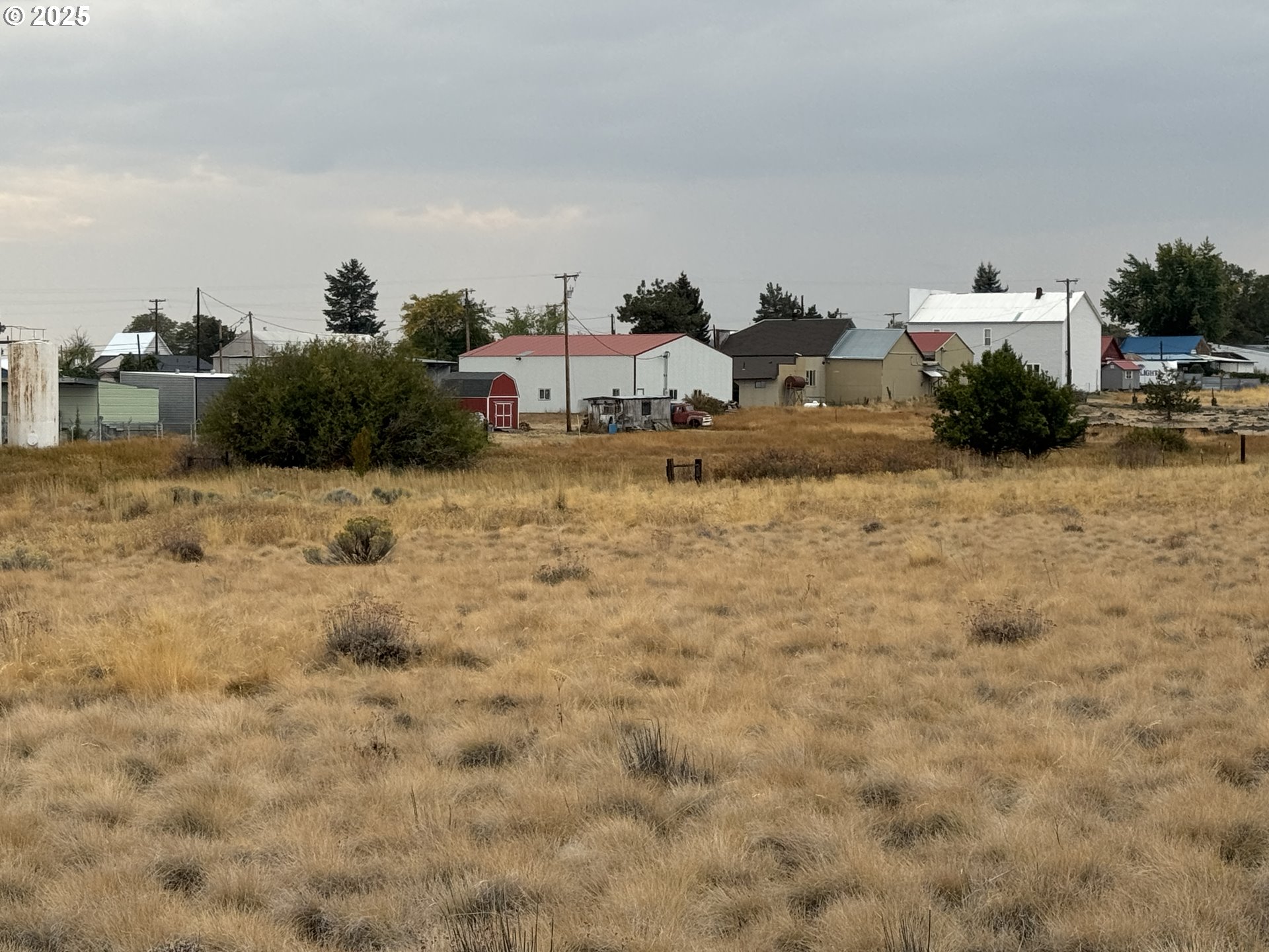 Cemetery Road Bickleton, WA 99322 - Photo 9 of 43 a view of a dry yard with wooden fence