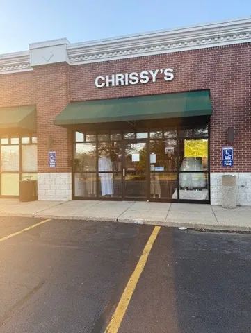 a front view of a building with glass windows and door