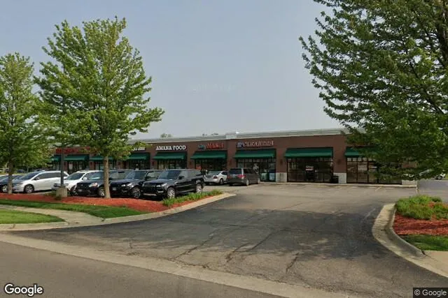 a view of a parked cars in front of a building