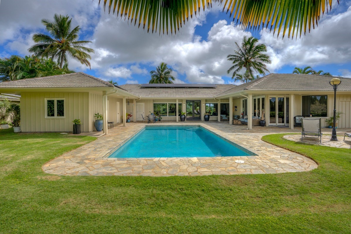 6472 Puupilo Road, Unit C Kapaa, HI 96746 - Photo 1 of 1 a view of a house with swimming pool and sitting area