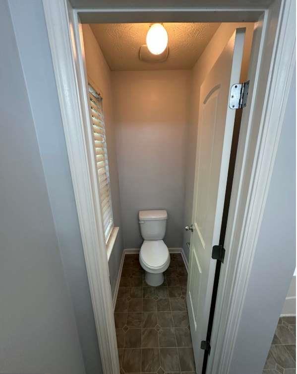 5103 Jack Drive Decatur, GA 30035 - Photo 14 of 34 a bathroom with a toilet and a shower