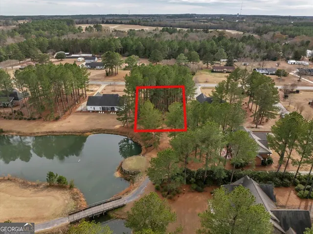 an aerial view of residential house with outdoor space and lake view