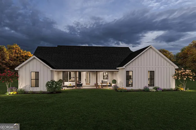 a view of house with backyard