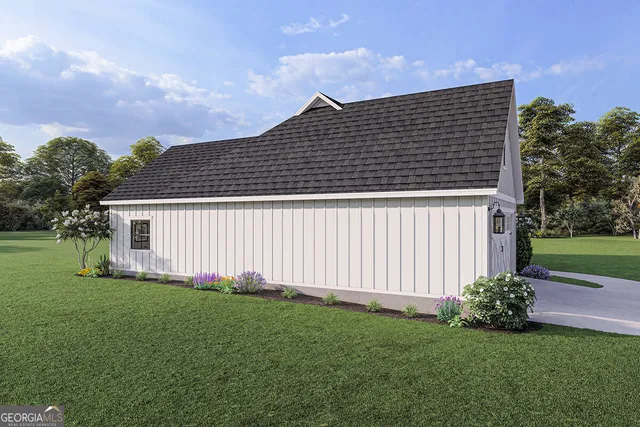 a front view of a house with a garden