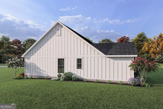 a view of a backyard with potted plants and large tree