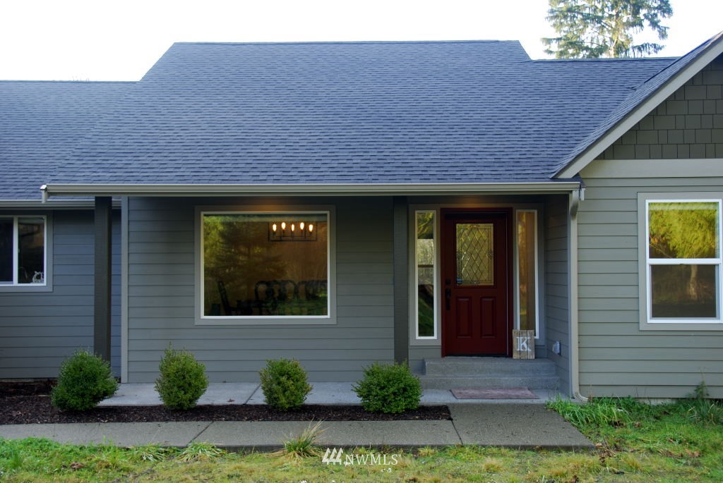 6221 133rd Avenue Southwest Rochester, WA 98579 - Photo 22 of 34 a front view of a house with garden