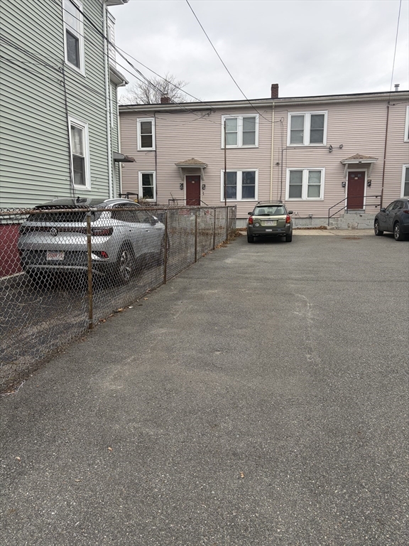 53 Oak Street, Unit 2 Somerville, MA 02143 - Photo 11 of 12 a view of a cars park in front of a building