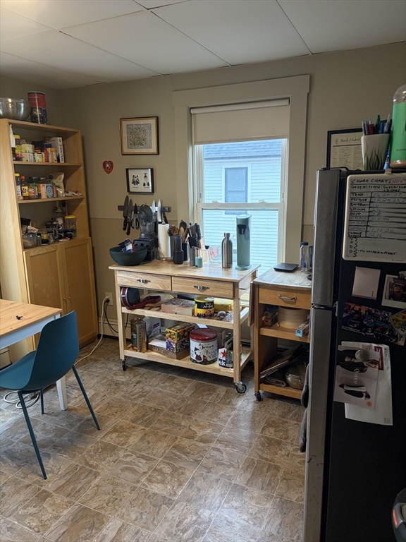 53 Oak Street, Unit 2 Somerville, MA 02143 - Photo 4 of 12 a bedroom with furniture and a book shelf