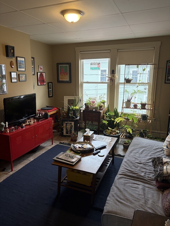 53 Oak Street, Unit 2 Somerville, MA 02143 - Photo 6 of 12 a living room with furniture and a flat screen tv