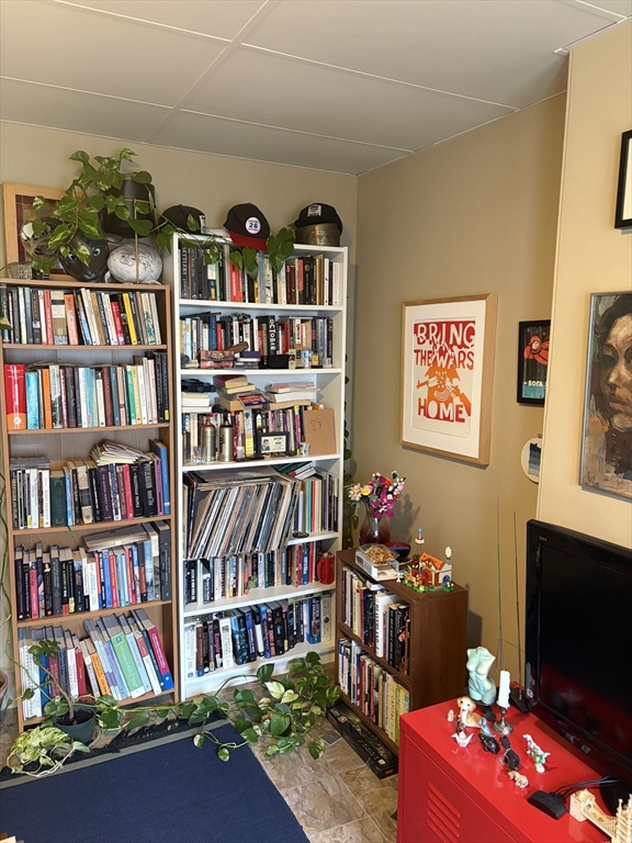 53 Oak Street, Unit 2 Somerville, MA 02143 - Photo 8 of 12 a book shelf with books and book shelf
