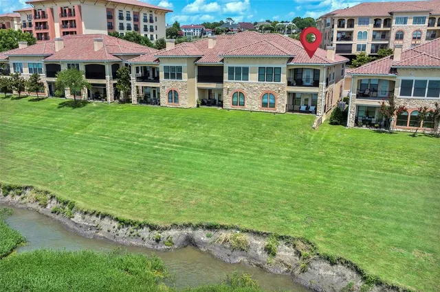 a front view of a house with a yard table and chairs