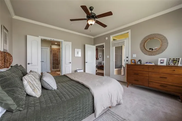 a bedroom with a bed and a mirror