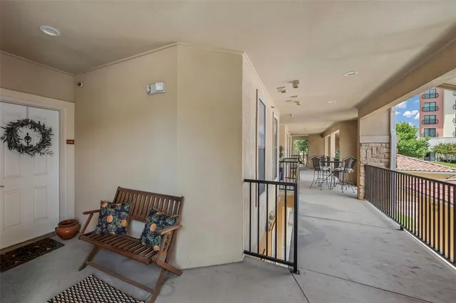 a view of a hallway with couch and dining area