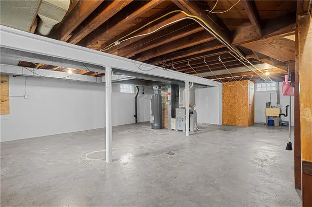 a view of empty room with wooden ceiling