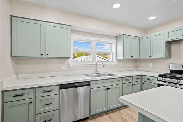 a kitchen with a sink cabinets and window