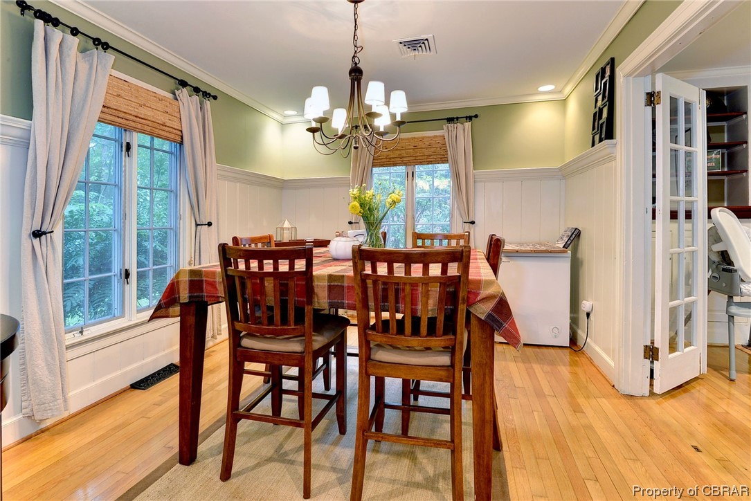 122 Selden Road Newport News, VA 23606 - Photo 6 of 38 Hardwood floored dining room with ornamental molding, and plenty of natural light