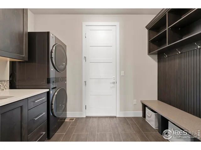 a kitchen with kitchen island a wooden floor and a sink