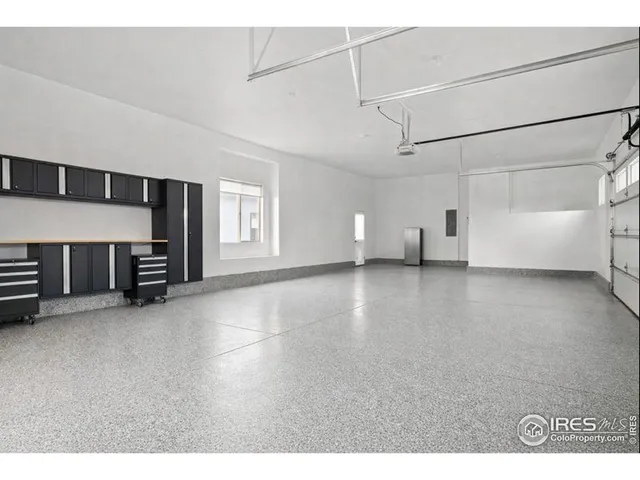 a view of a livingroom with furniture and an empty room