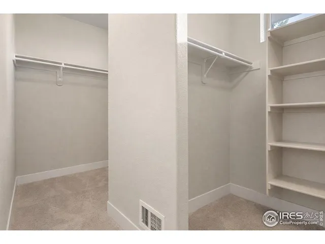 a view of an empty walk in closet