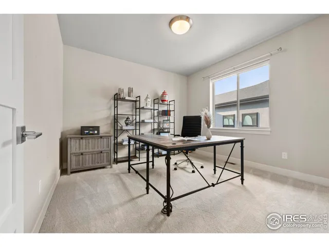 a workspace with furniture and a window