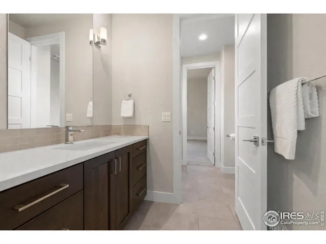 a bathroom with a sink a shower and a mirror