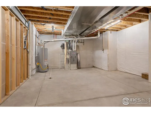 an aerial view of a house with garden space and street view
