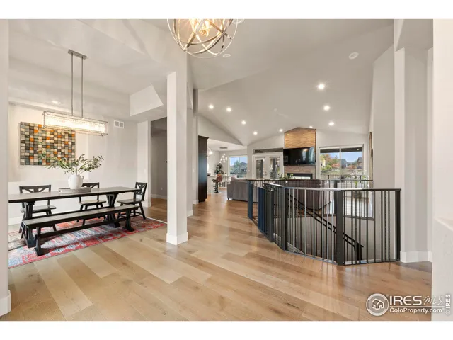a view of a living room and kitchen with furniture appliances