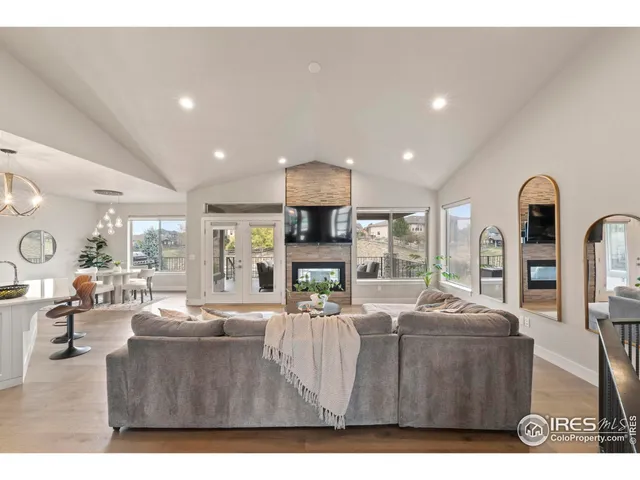 a living room with fireplace furniture and a flat screen tv