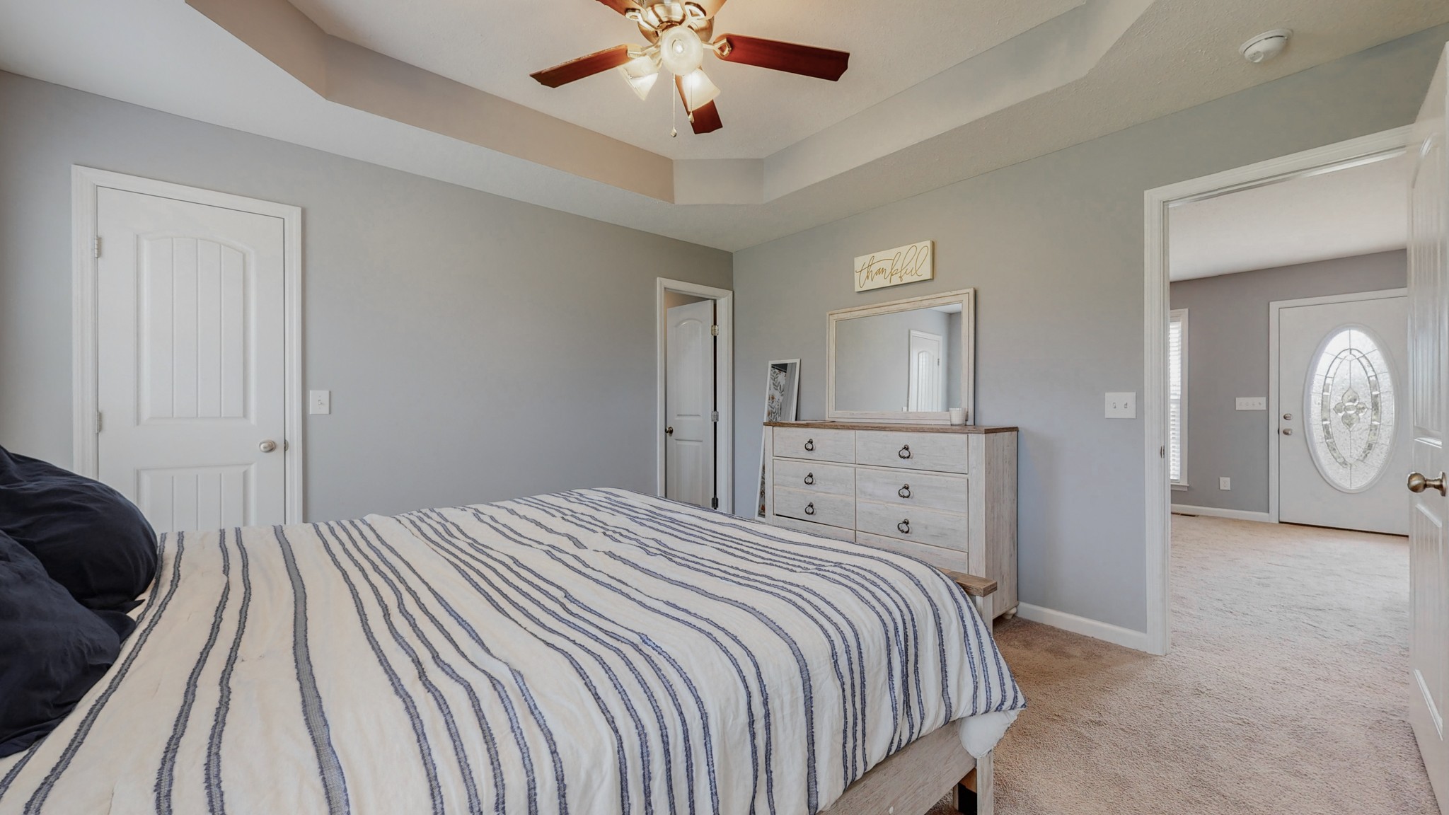 10 South Howard Fitch Road Fayetteville, TN 37334 - Photo 11 of 40 a bedroom with a bed and a chandelier