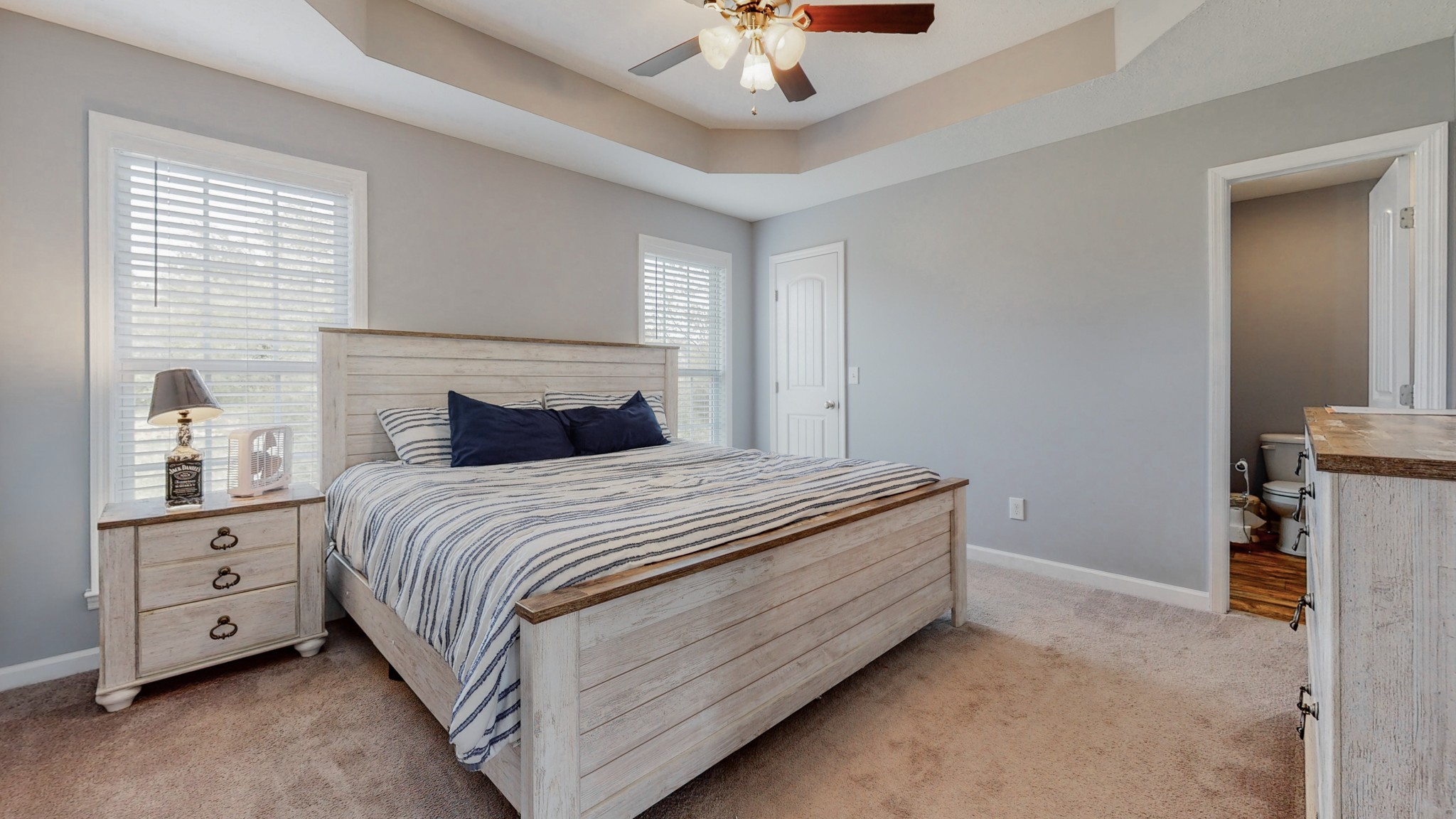 10 South Howard Fitch Road Fayetteville, TN 37334 - Photo 12 of 40 a bedroom with a bed and a chandelier