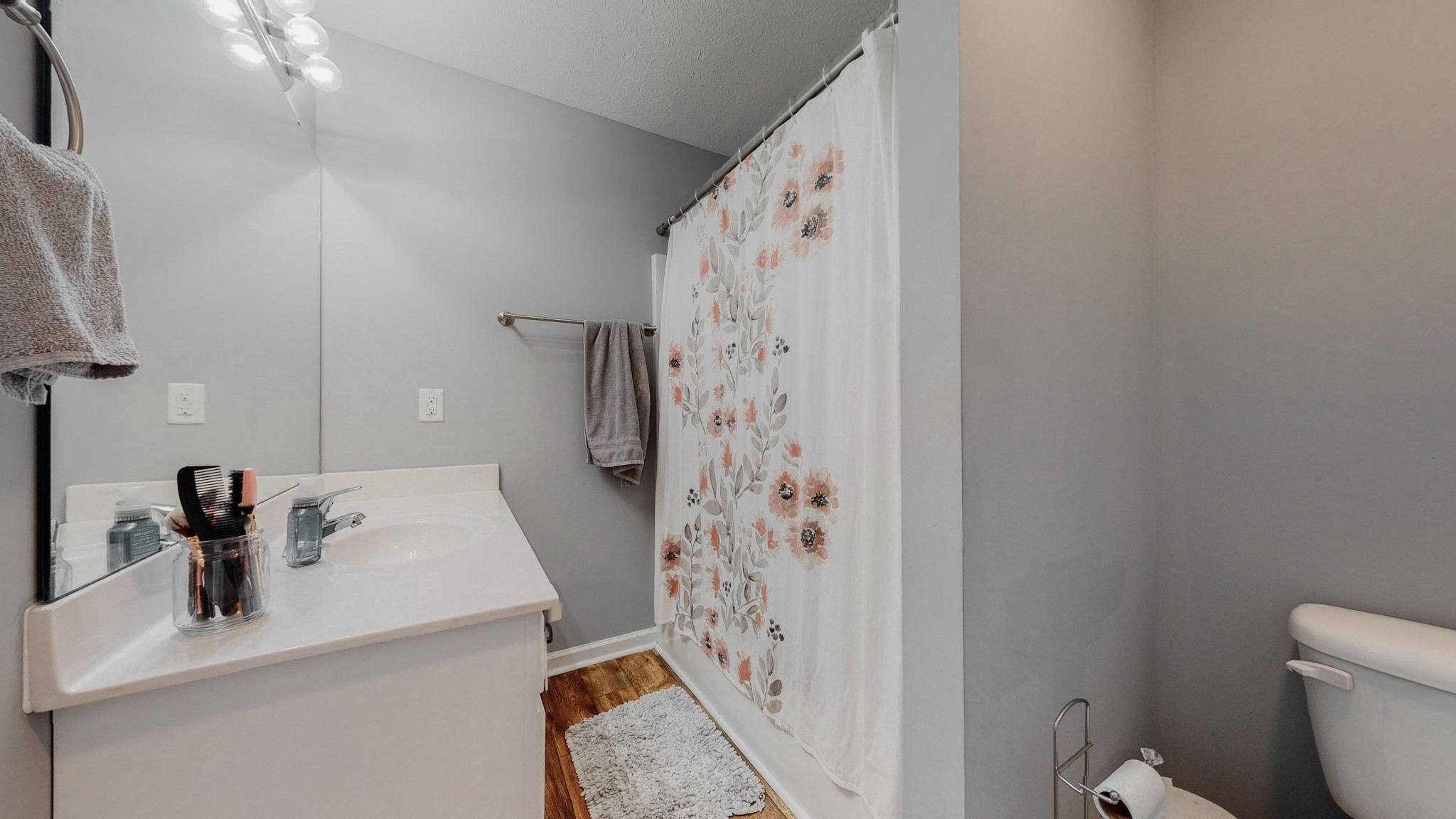 10 South Howard Fitch Road Fayetteville, TN 37334 - Photo 15 of 40 a bathroom with a sink a toilet and shower curtain