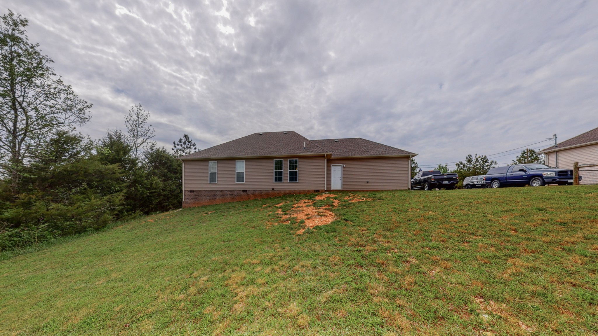 10 South Howard Fitch Road Fayetteville, TN 37334 - Photo 33 of 40 a front view of house with yard and trees in the background