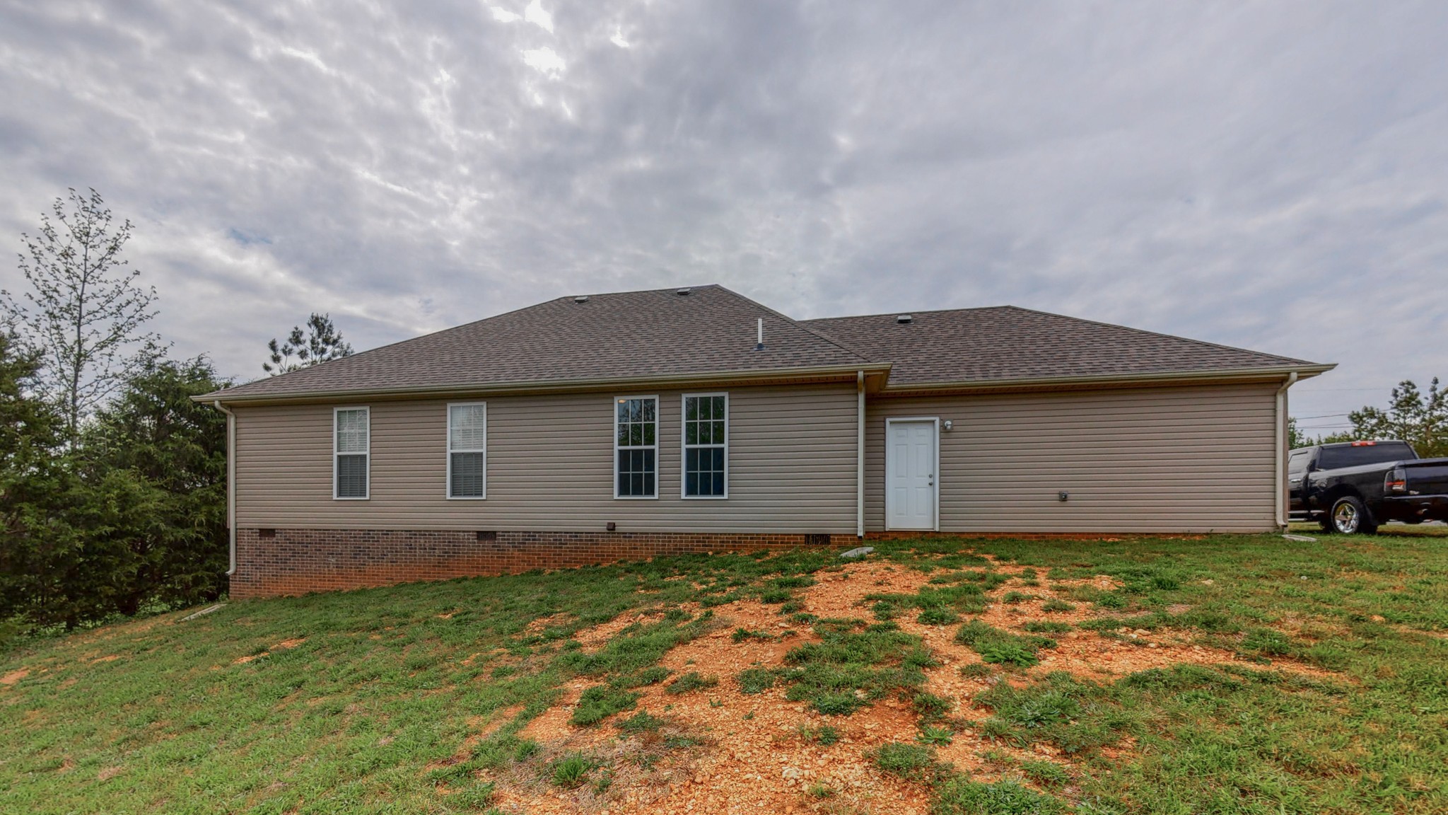 10 South Howard Fitch Road Fayetteville, TN 37334 - Photo 40 of 40 a front view of a house with a garden and yard