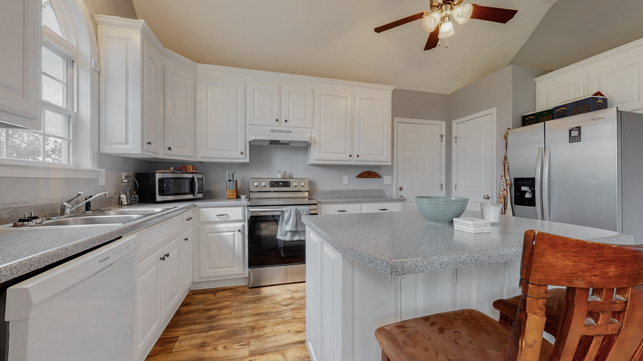 10 South Howard Fitch Road Fayetteville, TN 37334 - Photo 5 of 40 a kitchen with stainless steel appliances granite countertop a sink a stove and a refrigerator