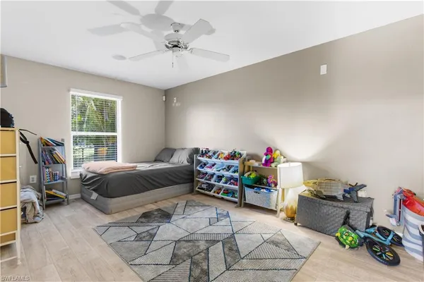 a bedroom with furniture and a window