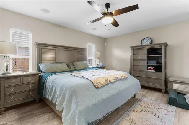 a bedroom with a bed and a television