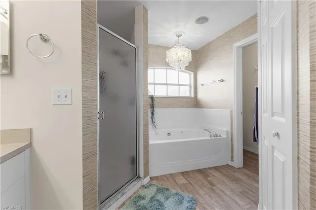 a bathroom with a bathtub and a shower