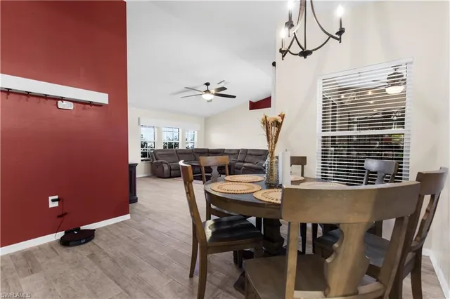 a view of a dining room with furniture and window