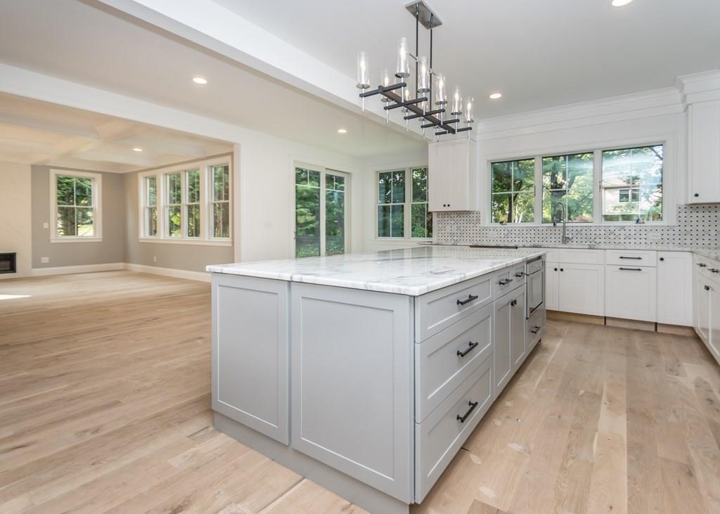 56 Pershing Road Needham, MA 02494 - Photo 12 of 42 a kitchen with center island and windows