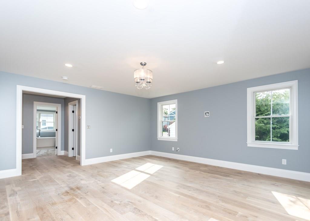 56 Pershing Road Needham, MA 02494 - Photo 18 of 42 an empty room with windows and closet