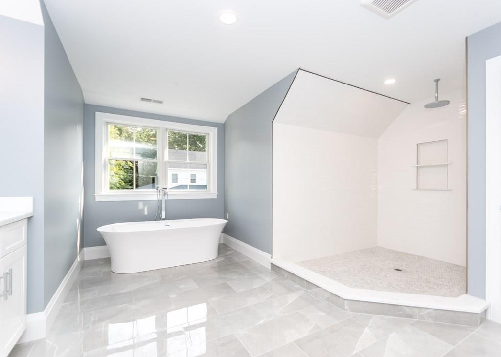 56 Pershing Road Needham, MA 02494 - Photo 22 of 42 a bathroom with a bathtub and a shower