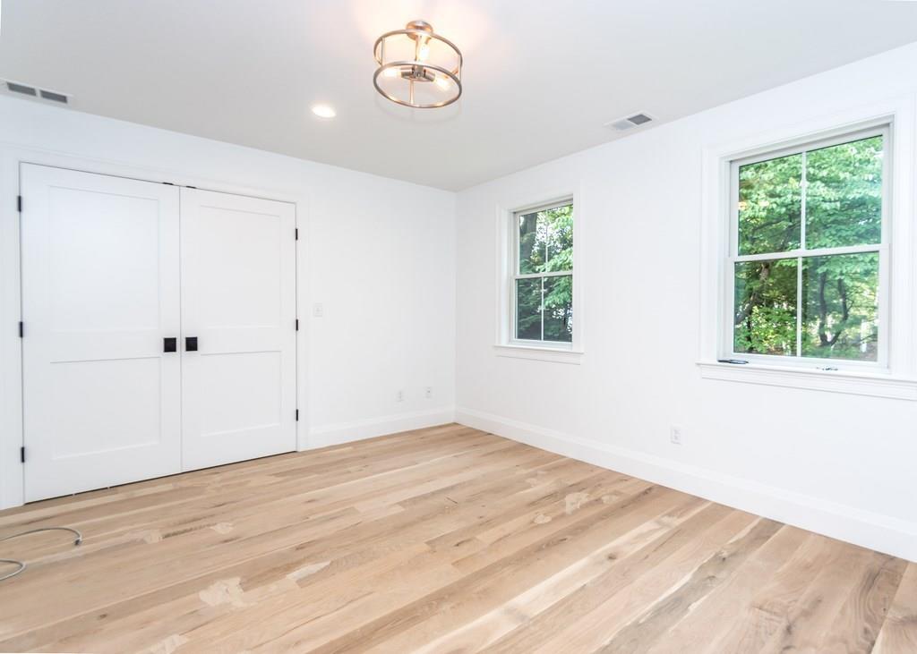 56 Pershing Road Needham, MA 02494 - Photo 24 of 42 wooden floor in an empty room with a window