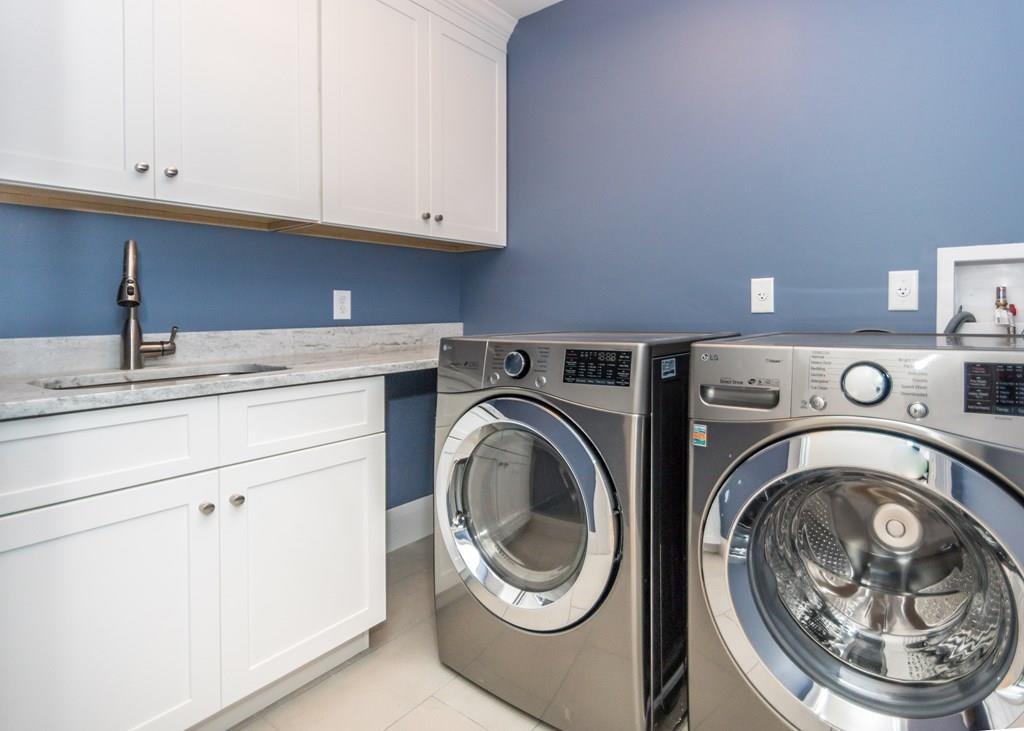 56 Pershing Road Needham, MA 02494 - Photo 29 of 42 a utility room with sink dryer and washer