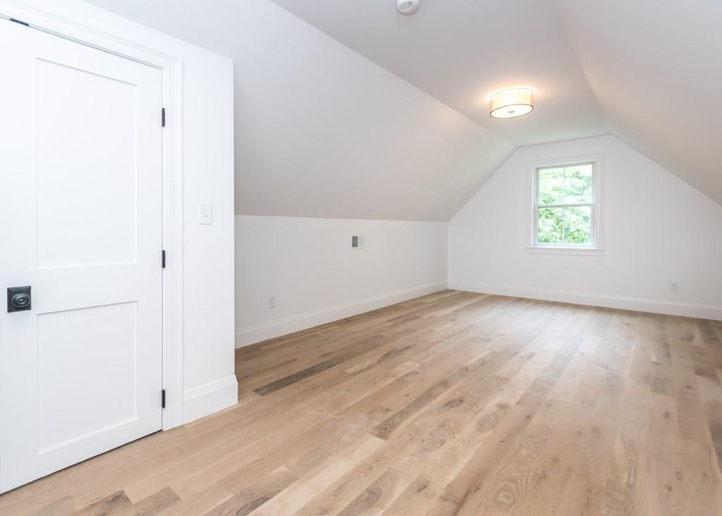 56 Pershing Road Needham, MA 02494 - Photo 30 of 42 an empty room with wooden floor and windows