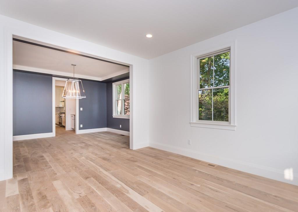 56 Pershing Road Needham, MA 02494 - Photo 3 of 42 a view of an empty room with wooden floor and a window