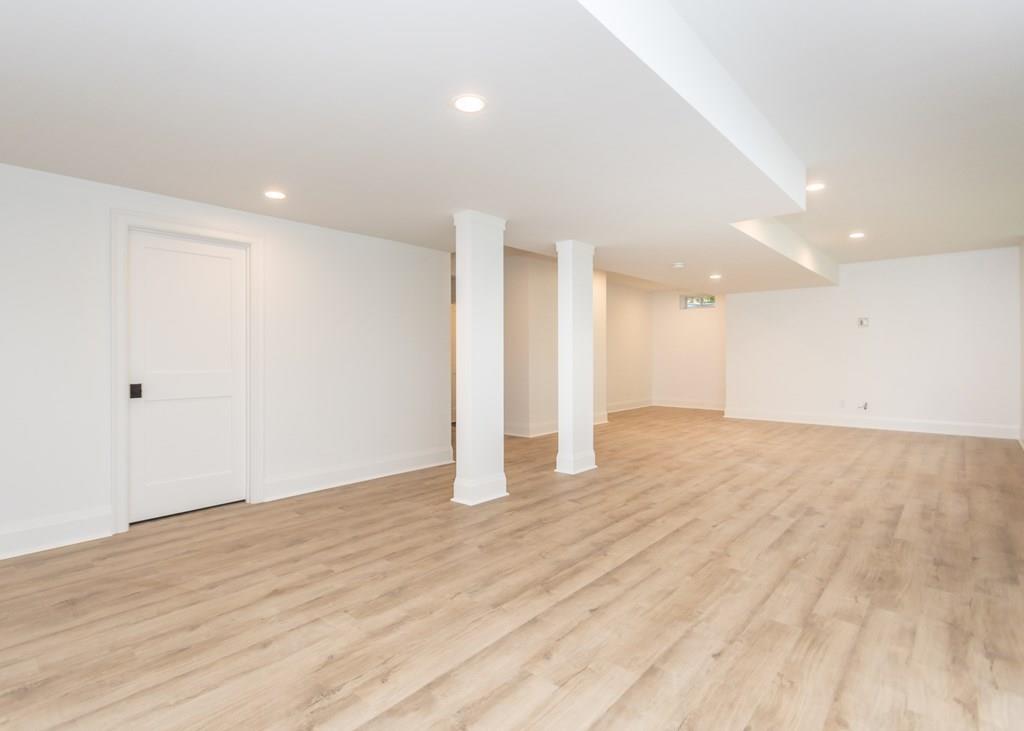 56 Pershing Road Needham, MA 02494 - Photo 32 of 42 a view of an empty room with wooden floor