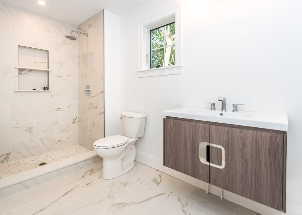 56 Pershing Road Needham, MA 02494 - Photo 34 of 42 a bathroom with a sink a toilet and shower