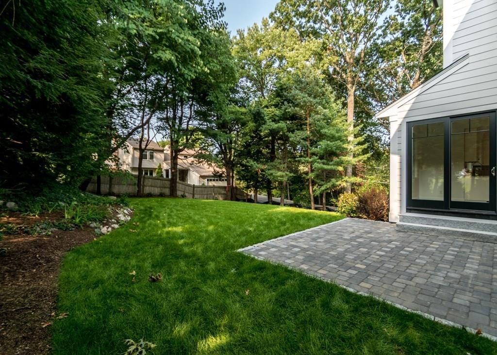 56 Pershing Road Needham, MA 02494 - Photo 37 of 42 a view of a yard with a house
