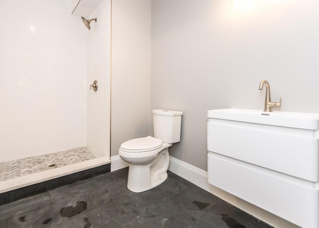 56 Pershing Road Needham, MA 02494 - Photo 38 of 42 a bathroom with a toilet and a sink