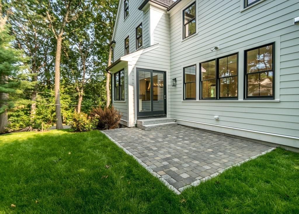 56 Pershing Road Needham, MA 02494 - Photo 39 of 42 a front view of a house with garden